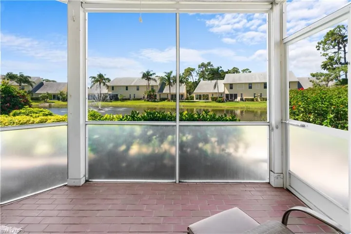 Unfurnished sunroom featuring a water view