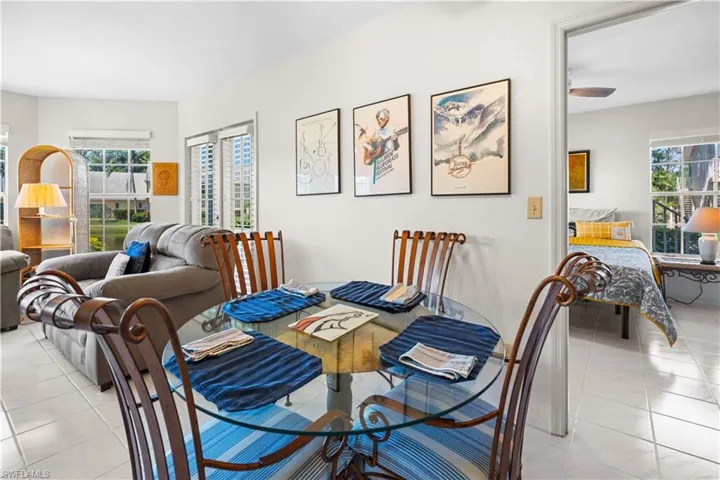 Dining space featuring plenty of natural light and light tile patterned floors