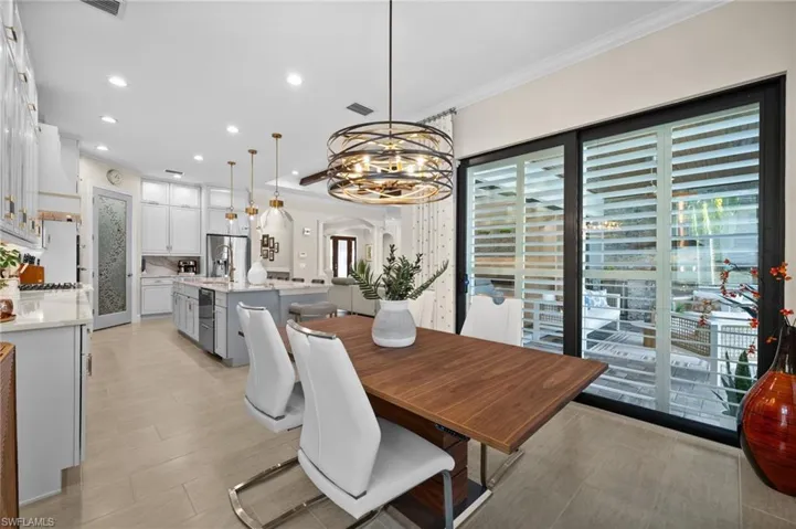 Dining space with walk-out sliding glass doors