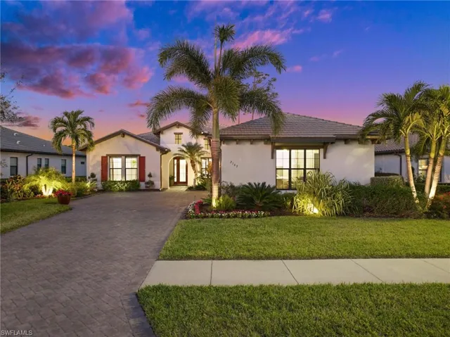 Front image of the home with large driveway+3 car garage