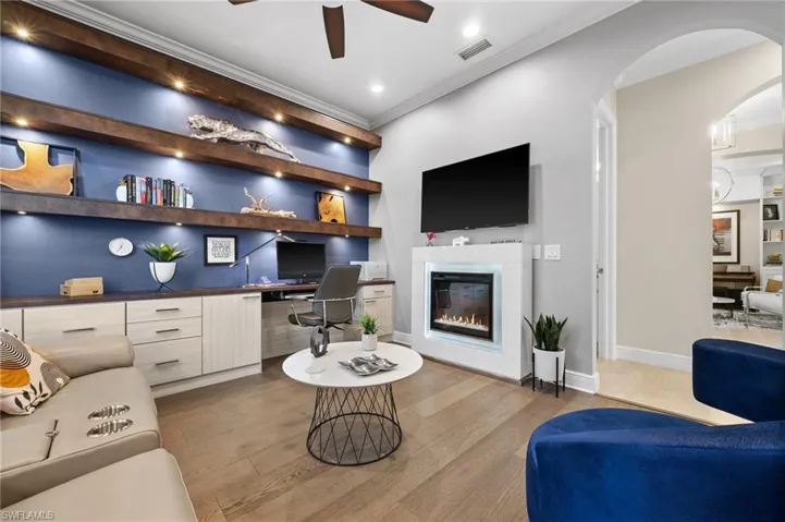 Office with custom wood shelving