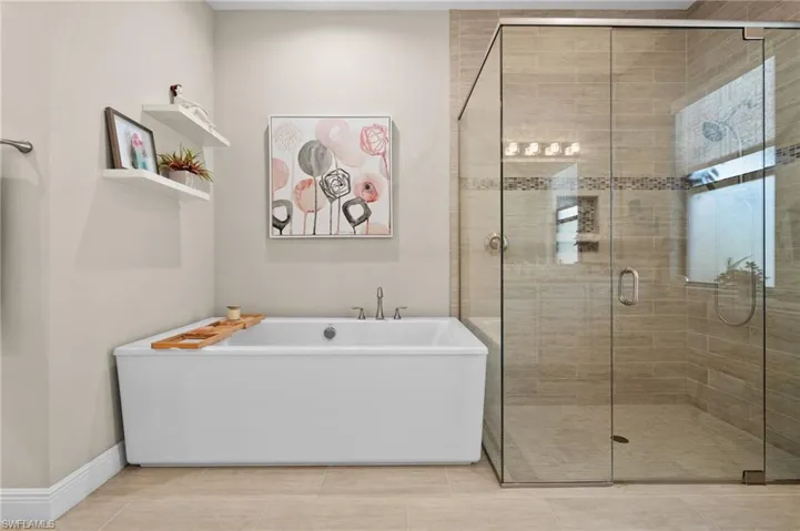 Master bath with tub and walk-in shower