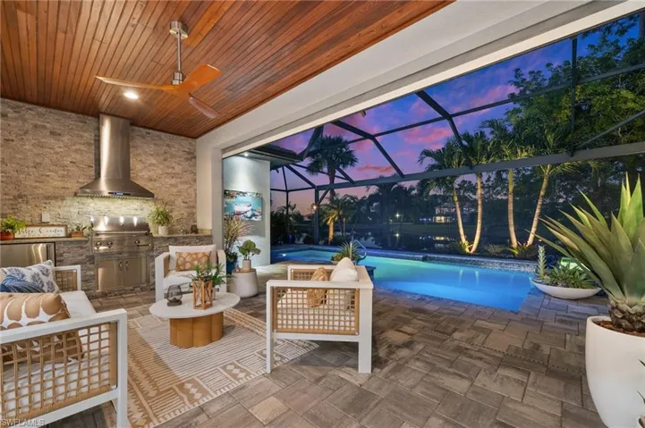 Covered outdoor area with custom outdoor kitchen