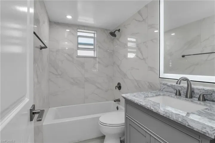 Bathroom with tub / shower combination and vanity
