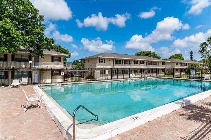 Community pool featuring a patio