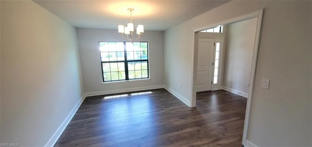 Dining Room and dark hardwood / wood-style flooring