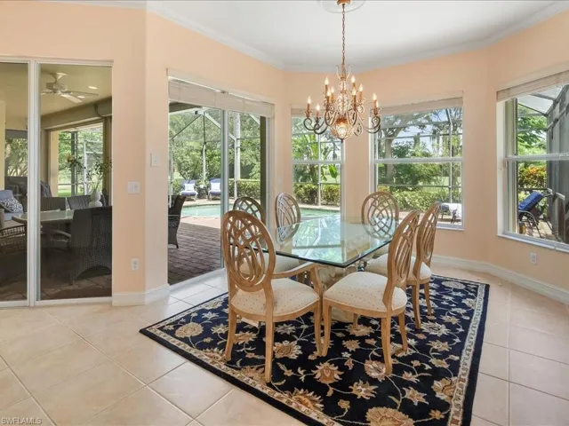 Large dining area with tropical and pool views.