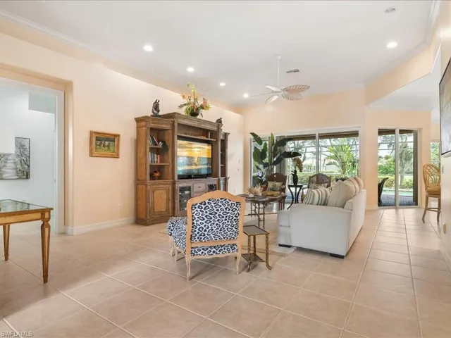 Huge great room with tons of light. Pool view