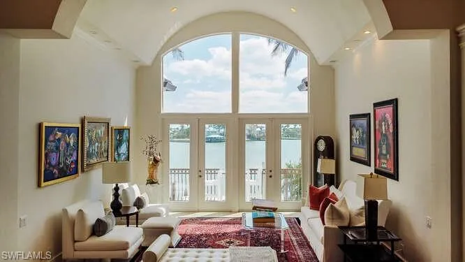 Doorway featuring french doors and a high ceiling