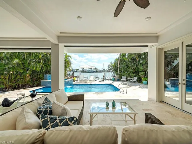 View of pool with a fenced in pool, a patio, ceiling fan, french doors, and outdoor lounge area