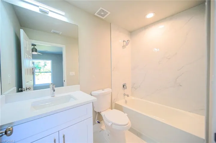 Tile Tub And Granite Countertops In The Master Bathroom