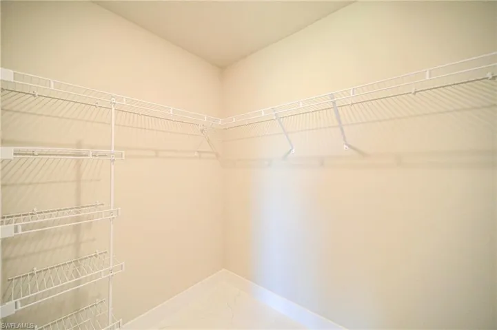 Large Walk-In Closet In The Master Bedroom