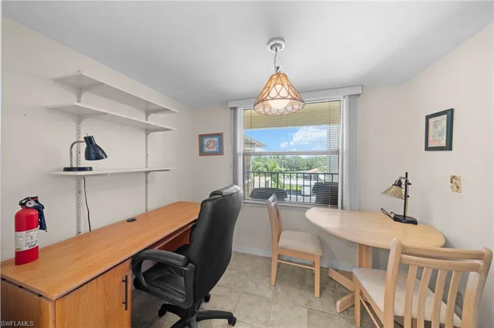Office featuring light tile patterned floors and baseboards