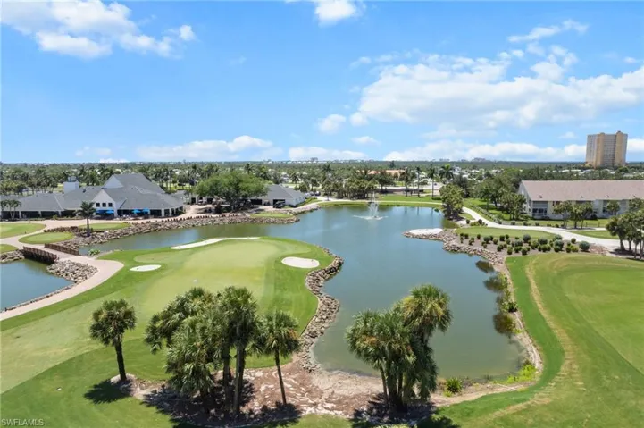 Bird's eye view of a local golf course and a nearby body of water