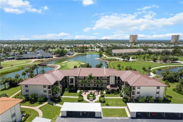 Aerial view of a local golf course and a large body of water