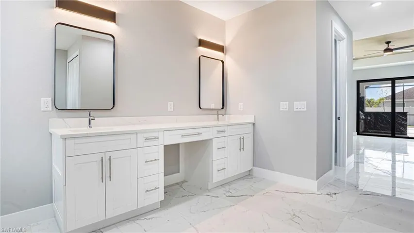 Bathroom with vanity and ceiling fan