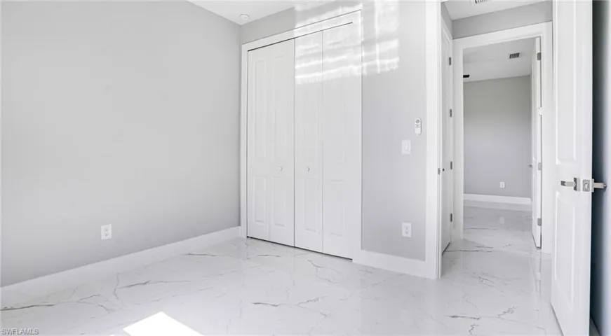 Unfurnished bedroom featuring a closet