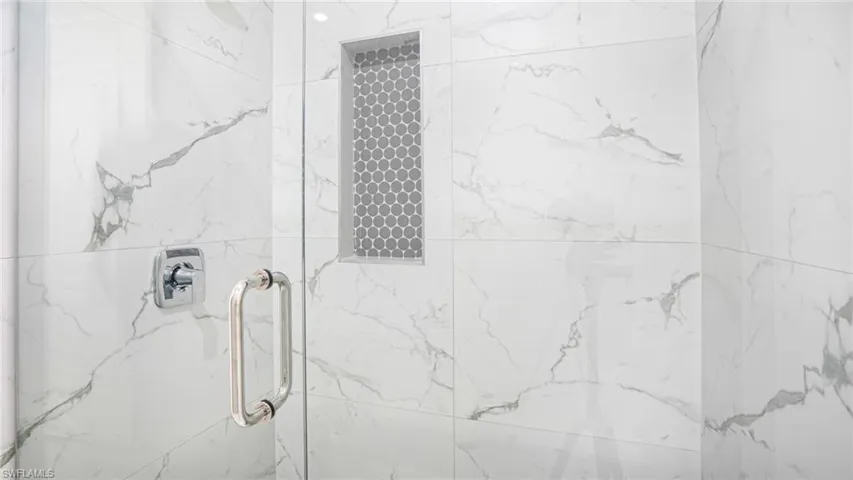 Bathroom with a shower with shower door