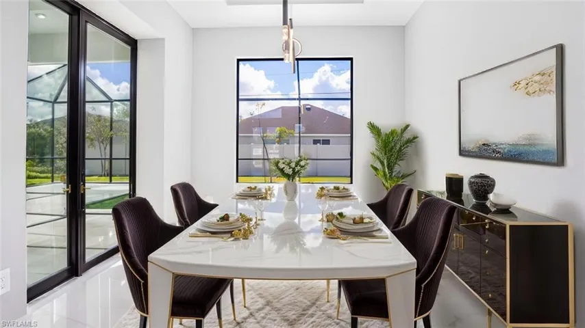 Dining area with light tile patterned flooring