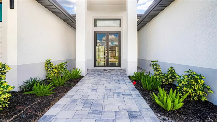 View of exterior entry featuring french doors