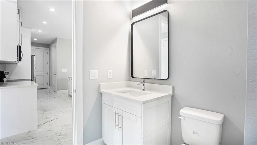 Bathroom with vanity and toilet