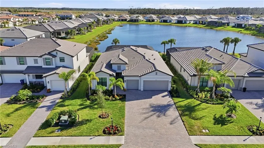Aerial perspective of suburban area with a large body of water