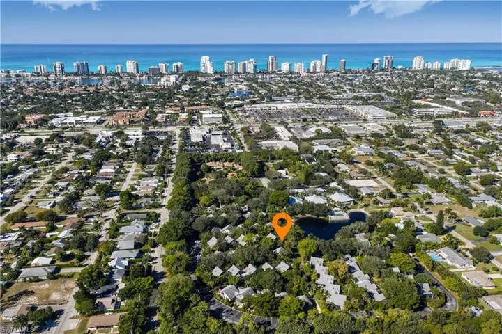 View of property location featuring a large body of water and nearby urban area