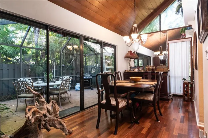 Dining area featuring a chandelier, wooden ceiling, healthy amount of natural light, and lofted ceiling