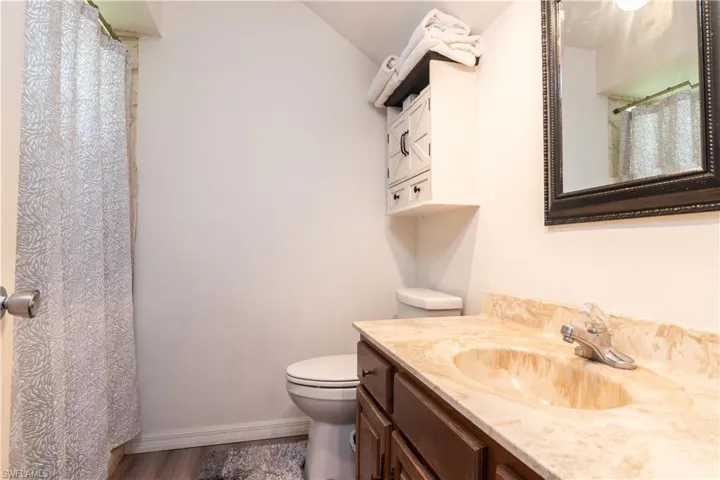 Full bath with a shower and vanity