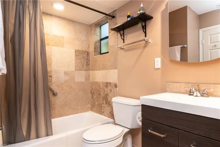 Full bathroom featuring shower / bathtub combination and vanity