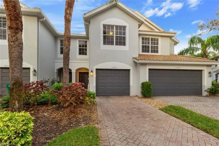 View of front facade featuring a garage