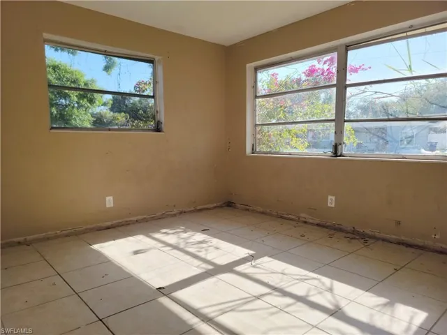 Unfurnished room with plenty of natural light