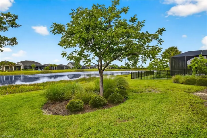 View of yard featuring a water view and a residential view