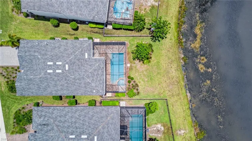 View of subject property with a pool