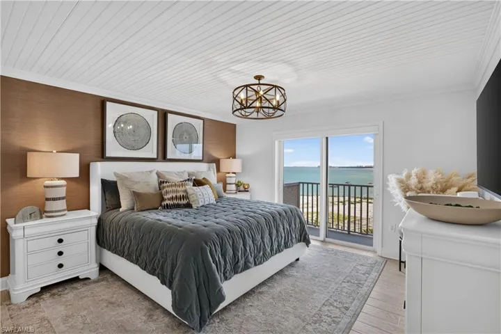 Spacious bedroom with updated lighting fixture and large closet.