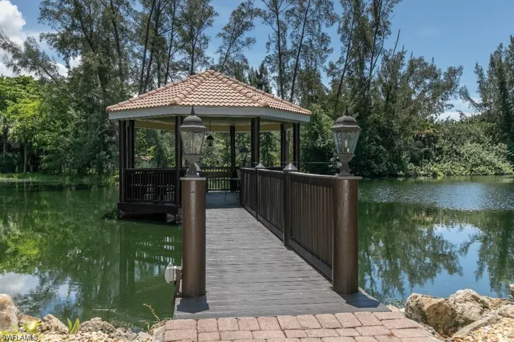 View of dock featuring a water view and a gazebo