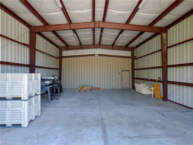 Garage featuring metal wall