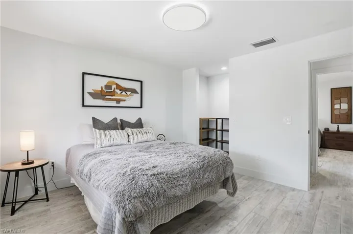 Bedroom featuring light wood-type flooring and recessed lighting
