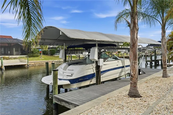 Dock with a water view and boat lift