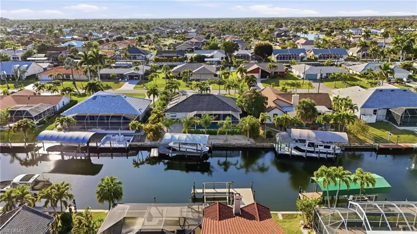 Aerial view of residential area featuring a large body of water