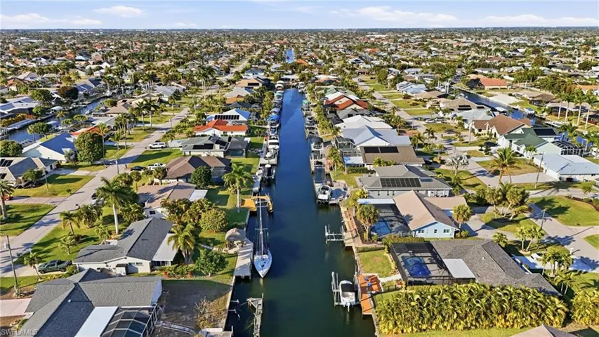 Aerial overview of property's location with nearby suburban area and a large body of water