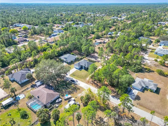 View of property location with nearby suburban area