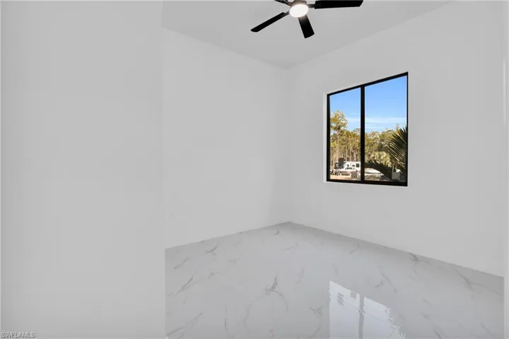 Spare room featuring a ceiling fan