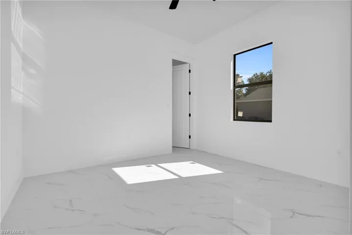 Unfurnished room featuring a ceiling fan
