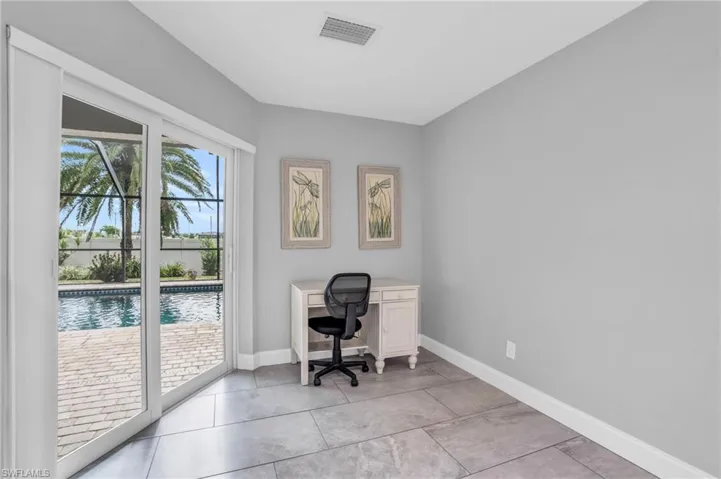 Home office with light tile patterned floors