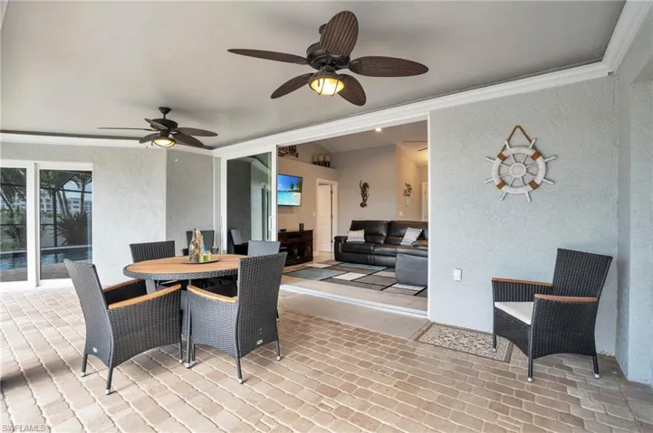 Dining room featuring ornamental molding and ceiling fan