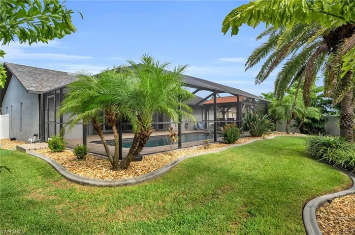 View of yard with a lanai