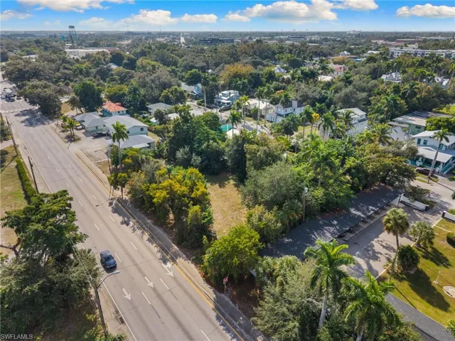 Aerial view of property's location with nearby suburban area
