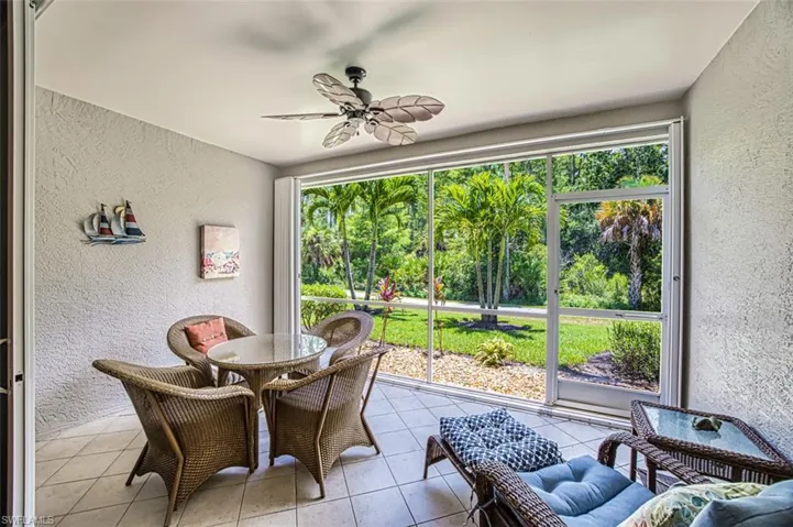 Sunroom with ceiling fan and a wealth of natural light