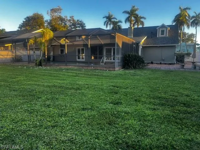 Rear view of property showing oversized back yard